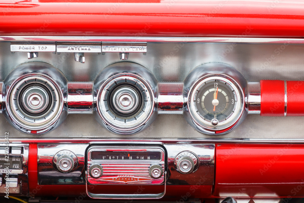 Close up at a dashboard with a radio in a vintage car