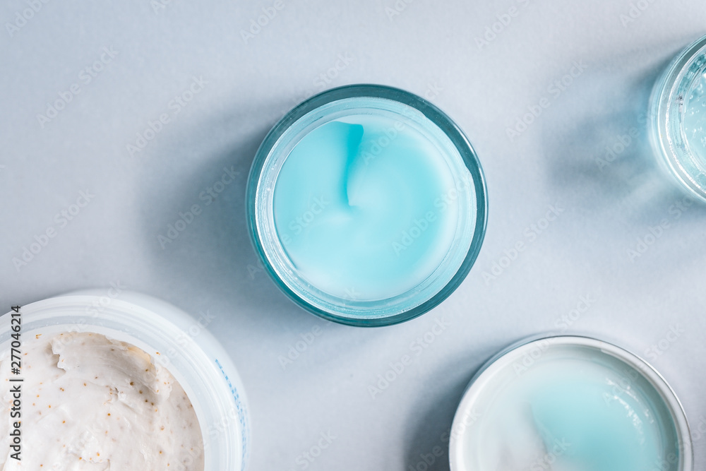 Female skin and body care cosmetic products set flatlay. Overhead, minimalism, beauty blogging concept Female skin and body care cosmetic products set flatlay. Overhead, minimalism, beauty blogging concept