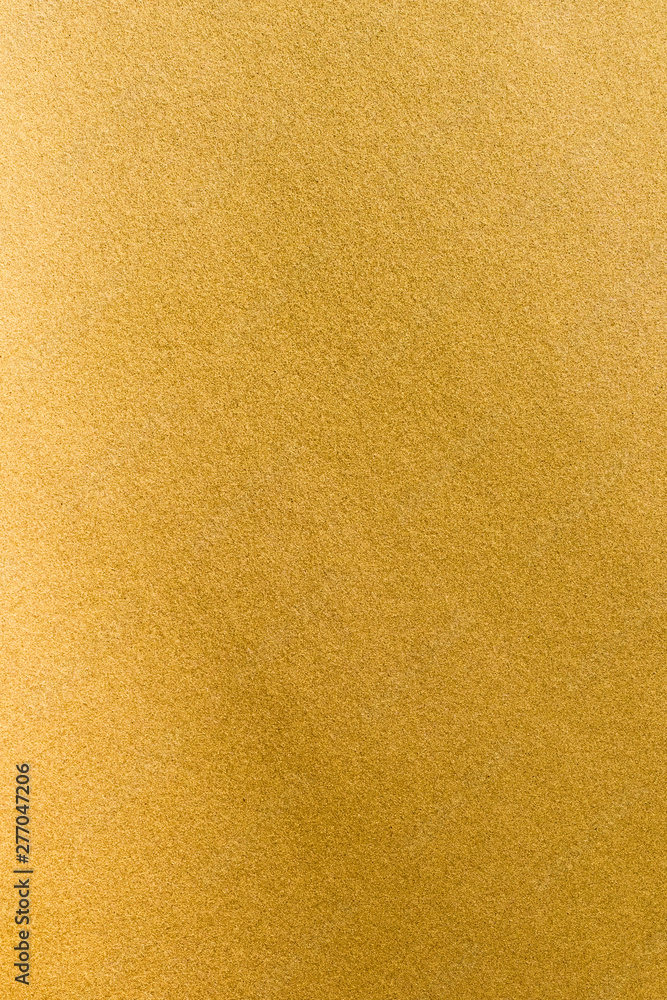 Naklejka premium Gold foil leaf shiny wrapping paper texture background for wall paper decoration element