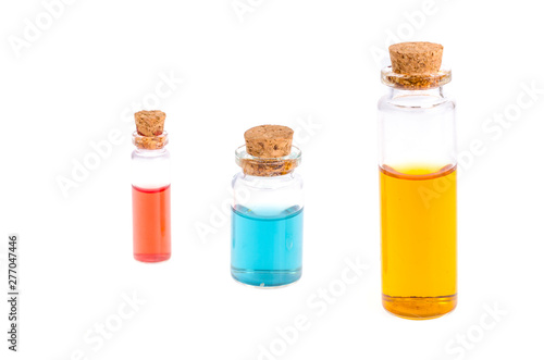 Glass medical bottles with colored liquid isolated on white. 