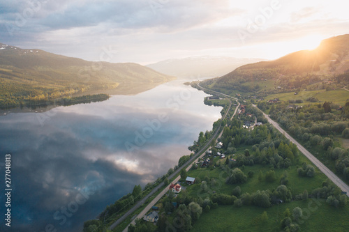 Wallpaper Mural Summer sunset over mountains with clouds reflecting in the water in Scandinavia Torontodigital.ca