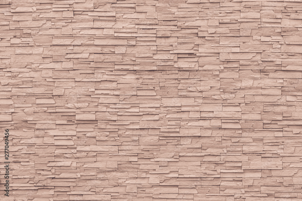 Rock stone brick tile wall aged texture detailed pattern background in cream red brown color Rock stone brick tile wall aged texture detailed pattern background in cream red brown color