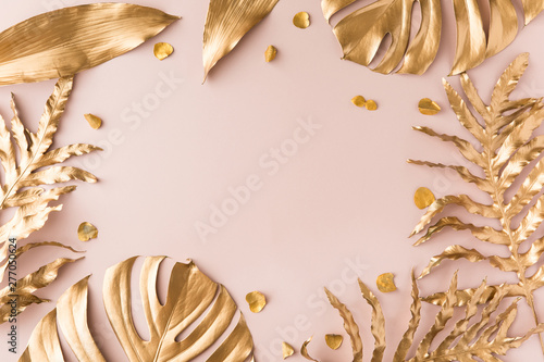 Flat lay of golden tropical leaf design elements. Decoration elements for inv...