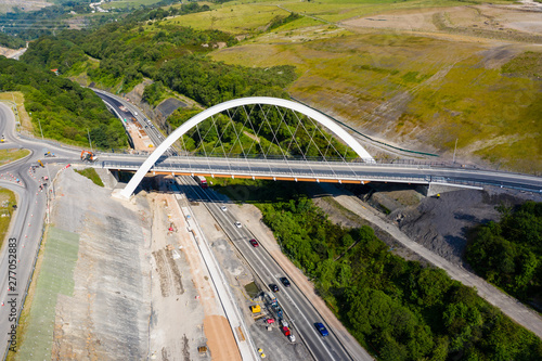Aerial view of a newly constructed bridge above major roadworks (A465,Wales,UK)