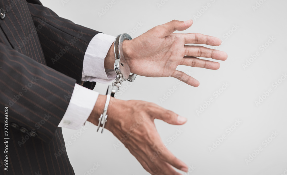 Businessman with handcuffs