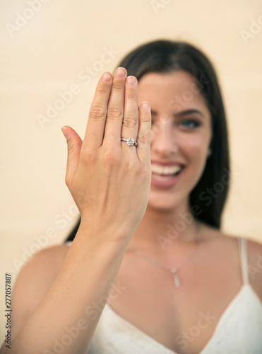 Woman showing diamond ring