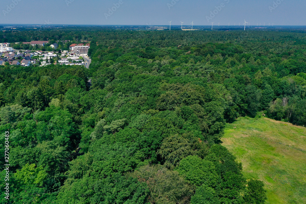 Fototapeta premium Soil heaps and material for soil recycling at the edge of a sand pit in Germany, taken from the air with the drone flight