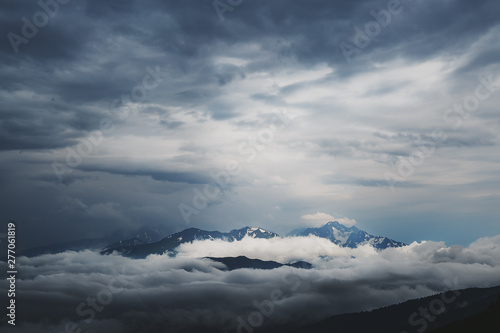 Storm clouds in a valley above a ridge. Republic of Adygea