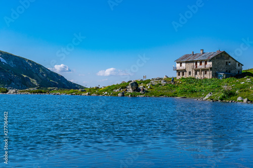 Fish lake, one of the seven rila lakes in Bulgaria with Seven lakes hut photo