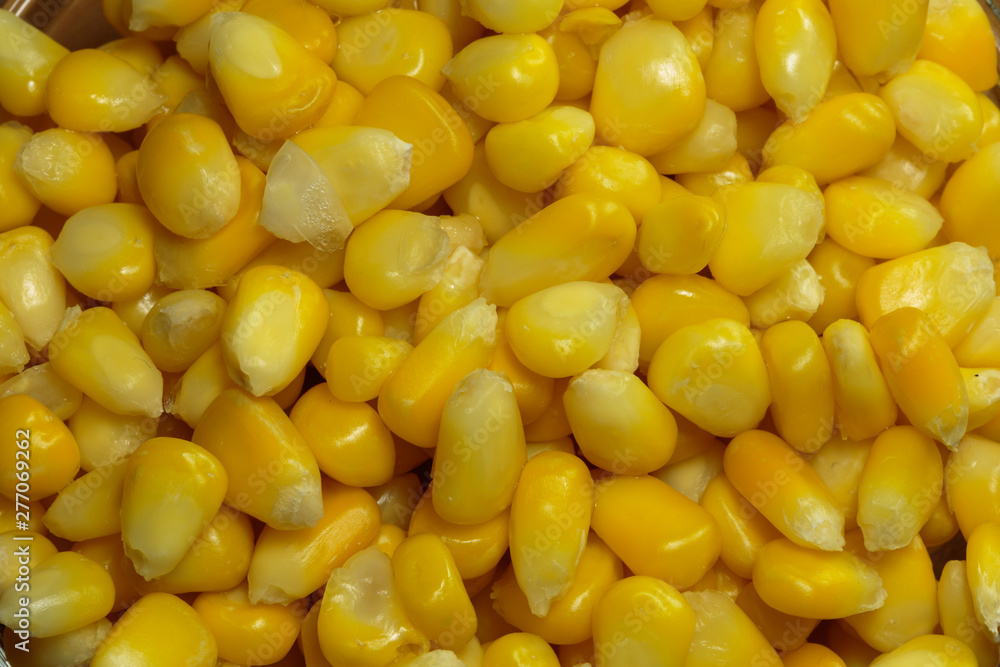 Yellow steamed corn grains. Steamed corn as a concept of a vegan food. Yellow steamed corn grains. Steamed corn as a concept of a vegan food.