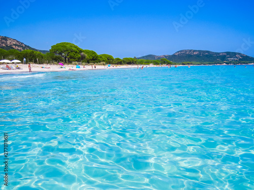 PALOMBAGGIA, FRANCE - AUGUST 4, 2014: Unidentified people on the beach of Palombaggia, Corsica.