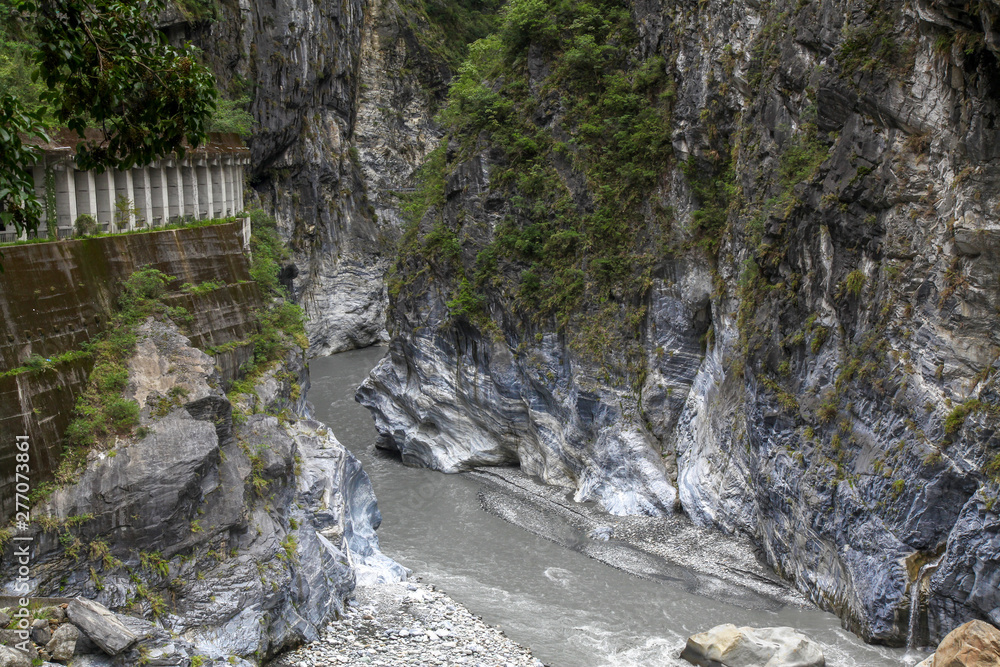 Dark river in taroko national park after rain storm in taiwan. Dark river in taroko national park after rain storm in taiwan.