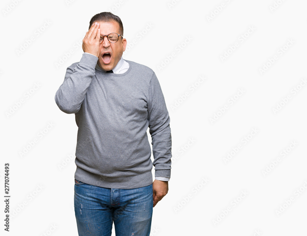 Middle age bussines arab man wearing glasses over isolated background covering one eye with hand with confident smile on face and surprise emotion. Middle age bussines arab man wearing glasses over isolated background covering one eye with hand with confident smile on face and surprise emotion.
