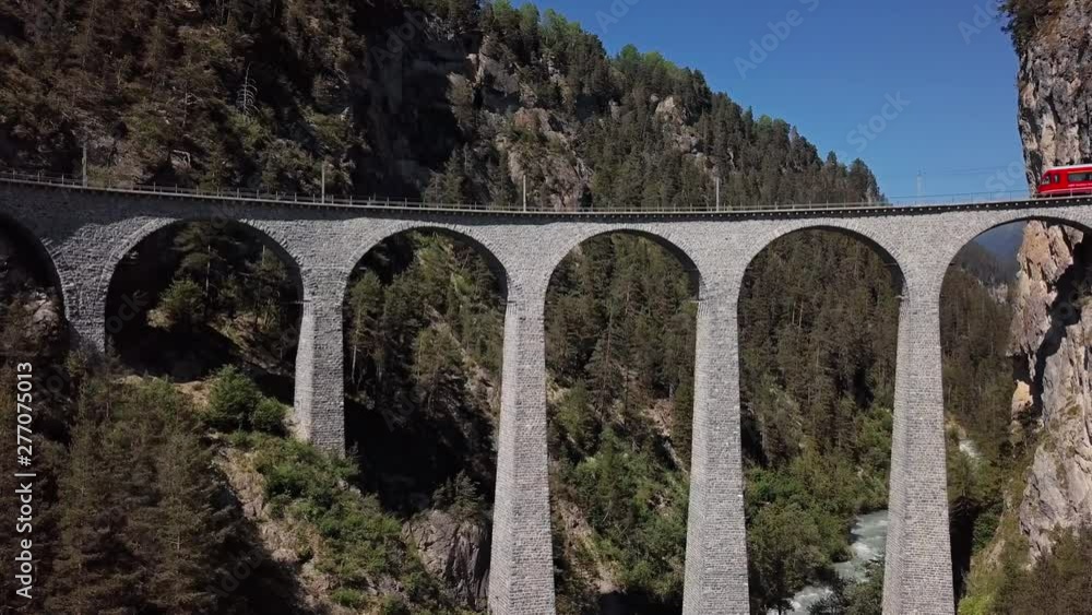 Aerial panorama of Swiss red train on famous Landwasser Viaduct (Landwasserviadukt), Graubunden, Switzerland. Aerial panorama of Swiss red train on famous Landwasser Viaduct (Landwasserviadukt), Graubunden, Switzerland.