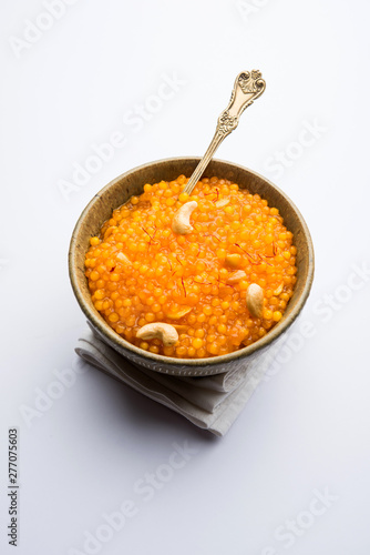 Sabudana or Sago Kesari dessert for Vrat Upvas also known as Sweetened Tapioca Pearl. served in a bowl. selective focus photo