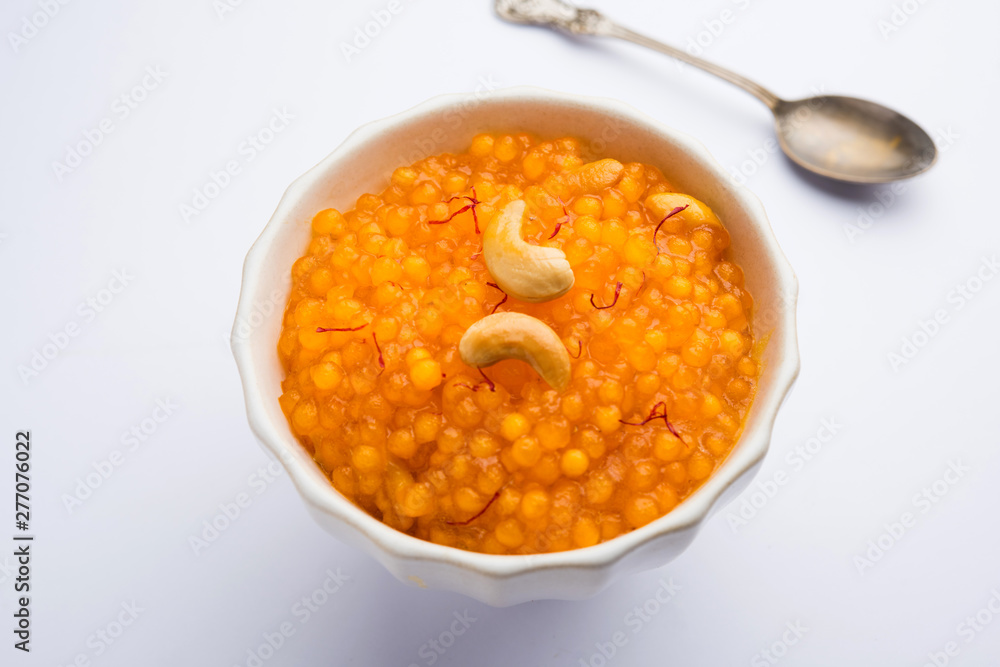 Sabudana or Sago Kesari dessert for Vrat Upvas also known as Sweetened Tapioca Pearl. served in a bowl. selective focus Sabudana or Sago Kesari dessert for Vrat Upvas also known as Sweetened Tapioca Pearl. served in a bowl. selective focus