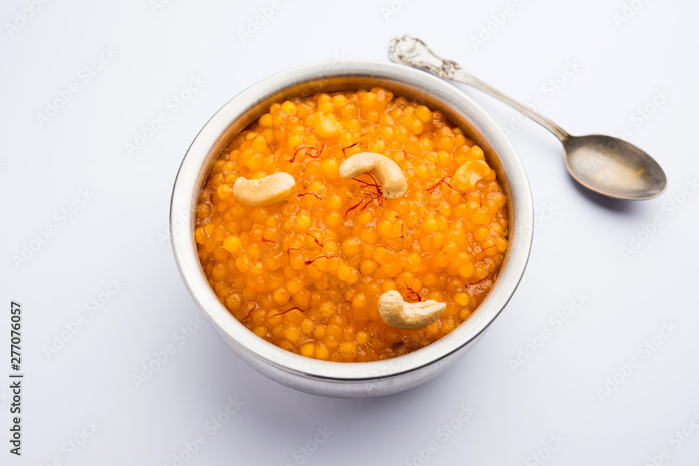 Sabudana or Sago Kesari dessert for Vrat Upvas also known as Sweetened Tapioca Pearl. served in a bowl. selective focus Sabudana or Sago Kesari dessert for Vrat Upvas also known as Sweetened Tapioca Pearl. served in a bowl. selective focus