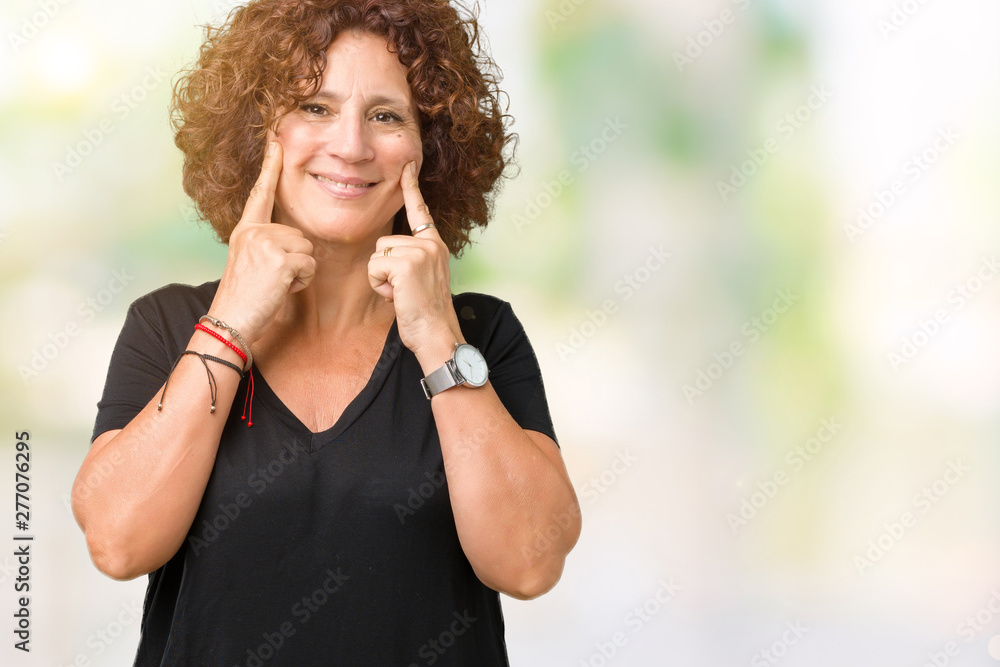 Beautiful middle ager senior woman over isolated background Smiling with open mouth, fingers pointing and forcing cheerful smile