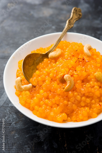 Sabudana or Sago Kesari dessert for Vrat Upvas also known as Sweetened Tapioca Pearl. served in a bowl. selective focus photo