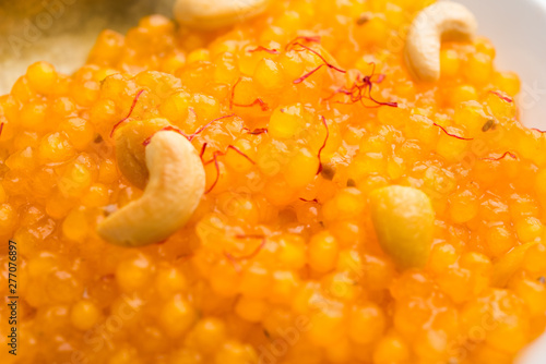 Sabudana or Sago Kesari dessert for Vrat Upvas also known as Sweetened Tapioca Pearl. served in a bowl. selective focus photo