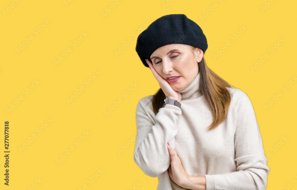 Middle age mature woman wearing winter sweater and beret over isolated background thinking looking tired and bored with depression problems with crossed arms. Middle age mature woman wearing winter sweater and beret over isolated background thinking looking tired and bored with depression problems with crossed arms.