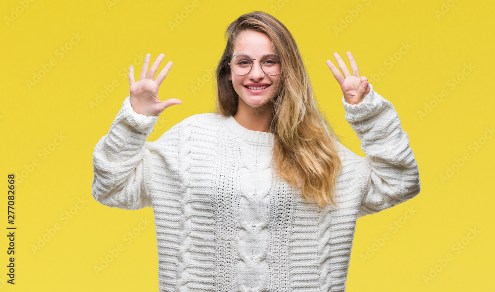 Young beautiful blonde woman wearing winter sweater and sunglasses over isolated background showing and pointing up with fingers number eight while smiling confident and happy. Young beautiful blonde woman wearing winter sweater and sunglasses over isolated background showing and pointing up with fingers number eight while smiling confident and happy.