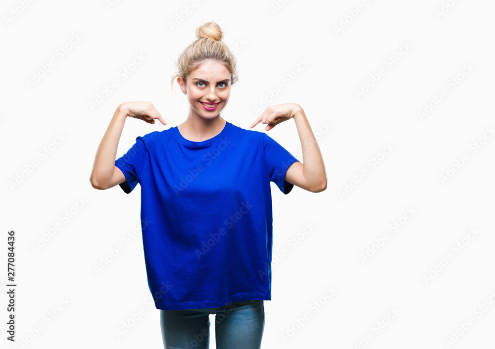 Young beautiful blonde and blue eyes woman wearing blue t-shirt over isolated background looking confident with smile on face, pointing oneself with fingers proud and happy. Young beautiful blonde and blue eyes woman wearing blue t-shirt over isolated background looking confident with smile on face, pointing oneself with fingers proud and happy.