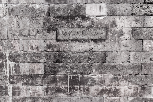 The old brick wall background or brick wall texture, or retro grunge wallpaper with the copy space