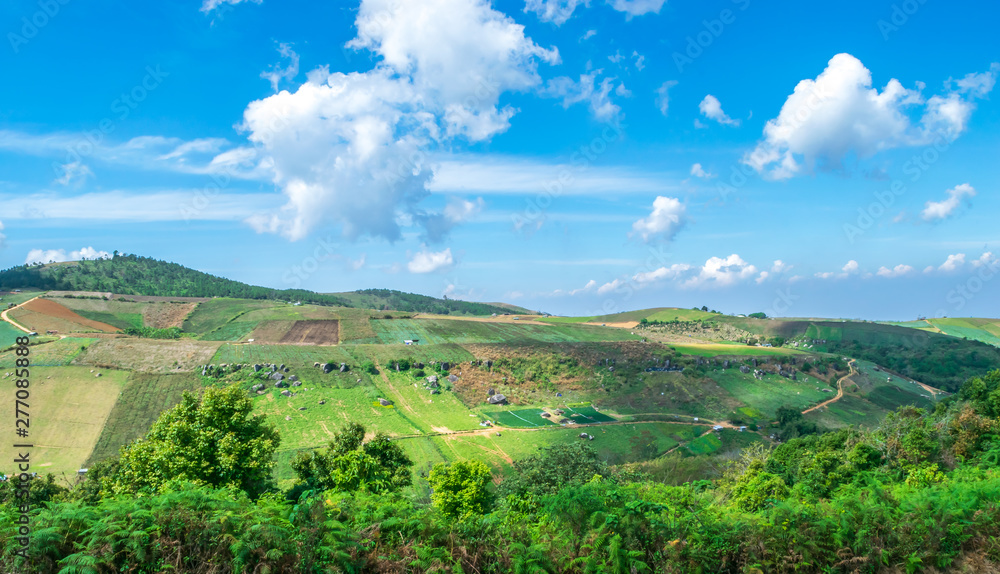 The green mountain view with clouds and blue sky in the beautiful day at Phu Lom Lo at Phu Hin Rong Kla National Park, Dasai District, Loei Province, Thailand.