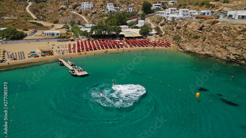Aerial drone photo of iconic organised beach of Super Paradise with emerald clear sandy seascape, Mykonos island, Cyclades, Greece