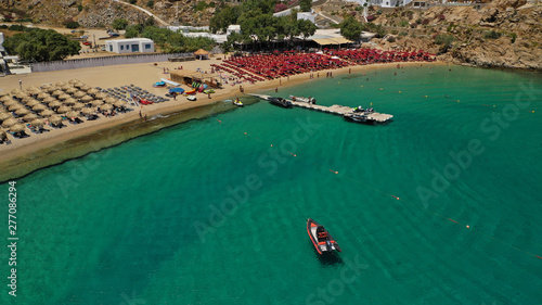 Aerial drone  bird s eye view photo of iconic and famous beach of Super Paradise with sapphire clear waters  Mykonos island  Cyclades  Greece