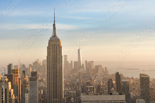 Top view of Manhattan Island and Empire State buildings. Day of sun with clouds. New York.