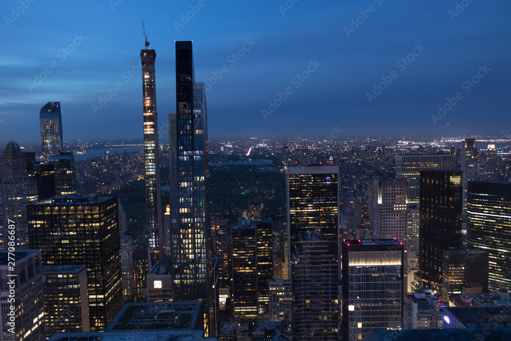 Top view of Manhattan buildings at night, New York.
