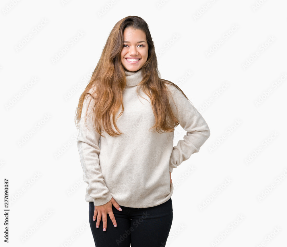 Young beautiful brunette woman wearing turtleneck sweater over isolated background with a happy and cool smile on face. Lucky person. Young beautiful brunette woman wearing turtleneck sweater over isolated background with a happy and cool smile on face. Lucky person.