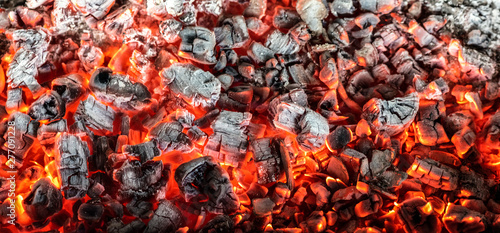Stampa su Tela Burning coals from a fire abstract background.