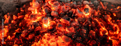 Fényképezés Burning coals from a fire abstract background.