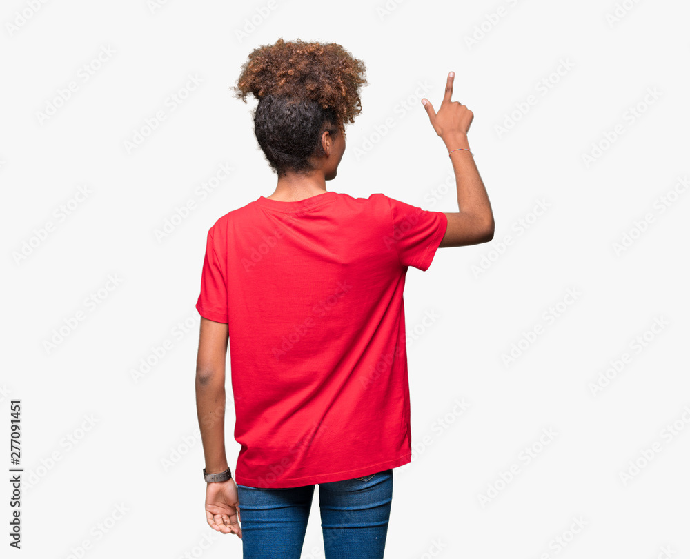 Beautiful young african american woman over isolated background Posing backwards pointing behind with finger hand Beautiful young african american woman over isolated background Posing backwards pointing behind with finger hand