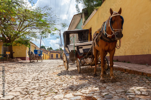 Horse Carriage in the streets of a small Cuban Town during a vibrant sunny day. Taken in Trinidad, Cuba.