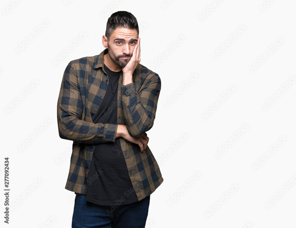Fototapeta premium Young handsome man over isolated background thinking looking tired and bored with depression problems with crossed arms.