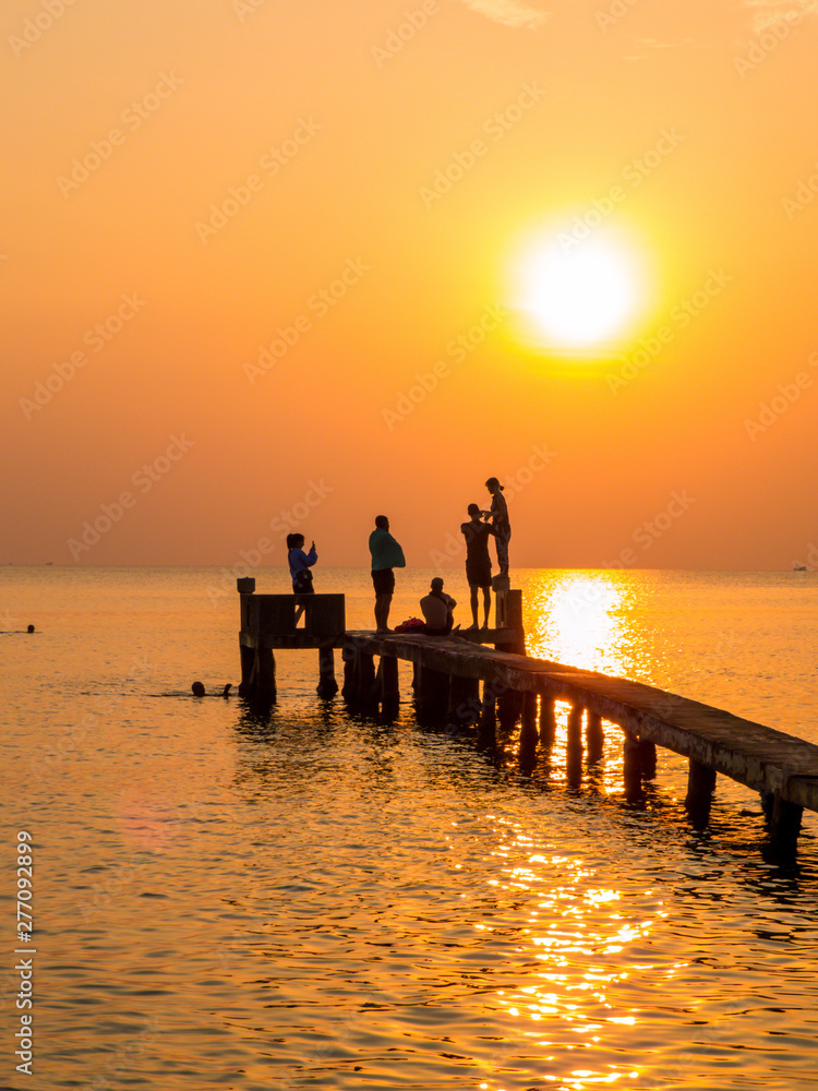 People on the pier at sunset. In Phu Quoc island, Vietnam People on the pier at sunset. In Phu Quoc island, Vietnam