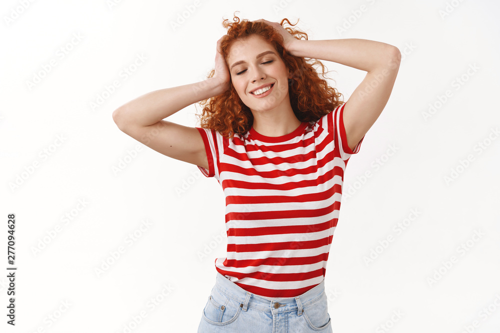 Beautiful tender european carefree redhead curly woman close eyes smiling happily feel relaxation joy playing hair touch head standing positive enjoy summer sunny day walking beach striped t-shirt Beautiful tender european carefree redhead curly woman close eyes smiling happily feel relaxation joy playing hair touch head standing positive enjoy summer sunny day walking beach striped t-shirt