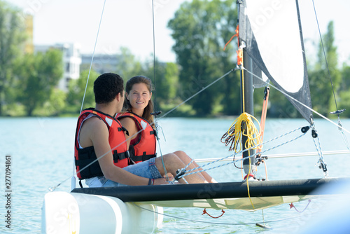 a couple is on a sailing trip