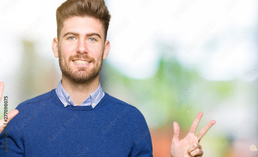 Young handsome bussines man showing and pointing up with fingers number eight while smiling confident and happy. Young handsome bussines man showing and pointing up with fingers number eight while smiling confident and happy.