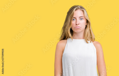 Beautiful young elegant woman over isolated background depressed and worry for distress, crying angry and afraid. Sad expression.
