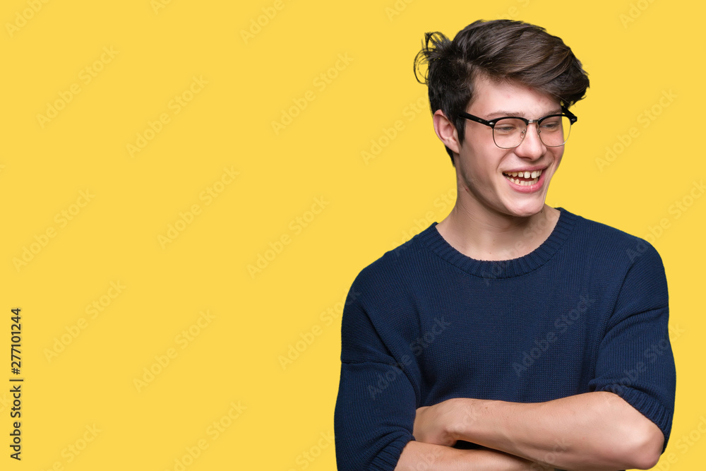 Young handsome man wearing glasses over isolated background happy face smiling with crossed arms looking at the camera. Positive person. Young handsome man wearing glasses over isolated background happy face smiling with crossed arms looking at the camera. Positive person.