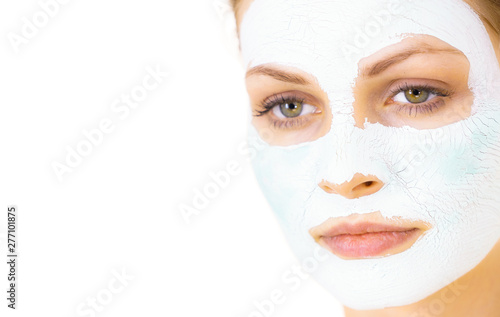 Girl with green mud mask on face