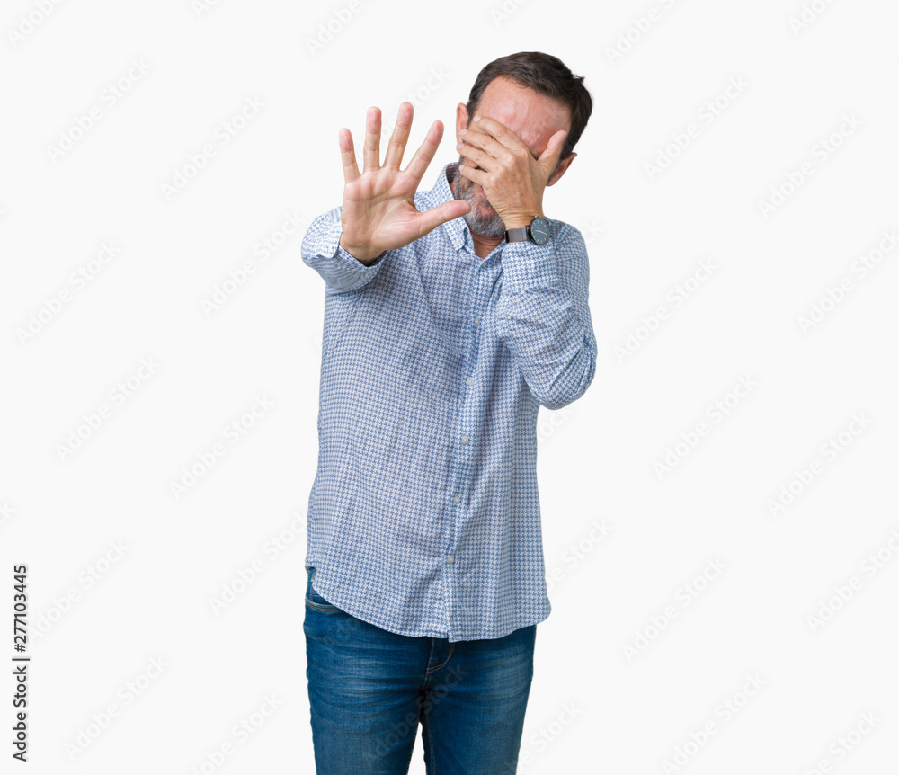 Handsome middle age elegant senior man over isolated background covering eyes with hands and doing stop gesture with sad and fear expression. Embarrassed and negative concept. Handsome middle age elegant senior man over isolated background covering eyes with hands and doing stop gesture with sad and fear expression. Embarrassed and negative concept.