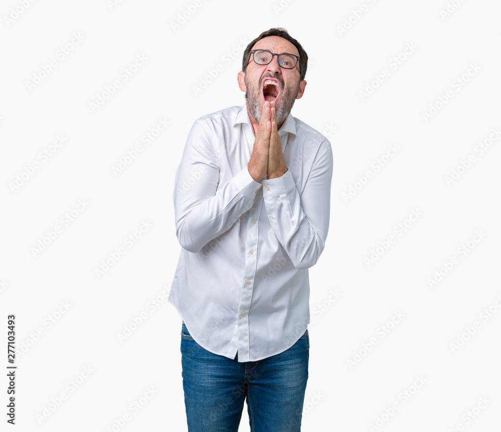 Handsome middle age elegant senior business man wearing glasses over isolated background begging and praying with hands together with hope expression on face very emotional and worried. Handsome middle age elegant senior business man wearing glasses over isolated background begging and praying with hands together with hope expression on face very emotional and worried.