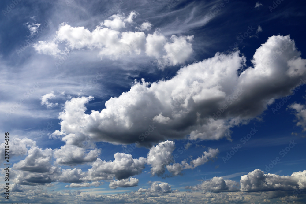 Blue sky covered with white cumulus clouds. Summer cloudscape, beautiful background for good weather Blue sky covered with white cumulus clouds. Summer cloudscape, beautiful background for good weather