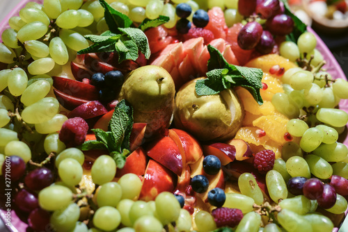 Fototapeta Naklejka Na Ścianę i Meble -  Buffet table. Fruits and berries rainbow top view. Natural vitamins and antioxidants food concept. Detox